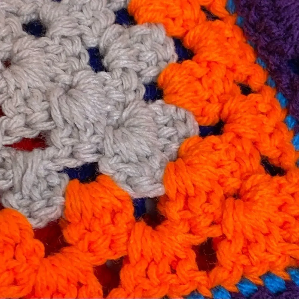 Hand crocheted bright multi colored Afghan size 56” X 31”